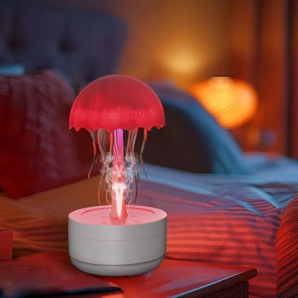 White jellyfish humidifier diffuser with colourful night light on desktop