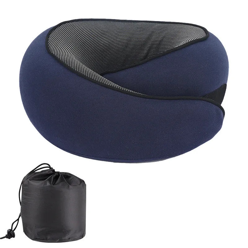 Grey U-shaped memory foam travel neck pillow with a storage bag.