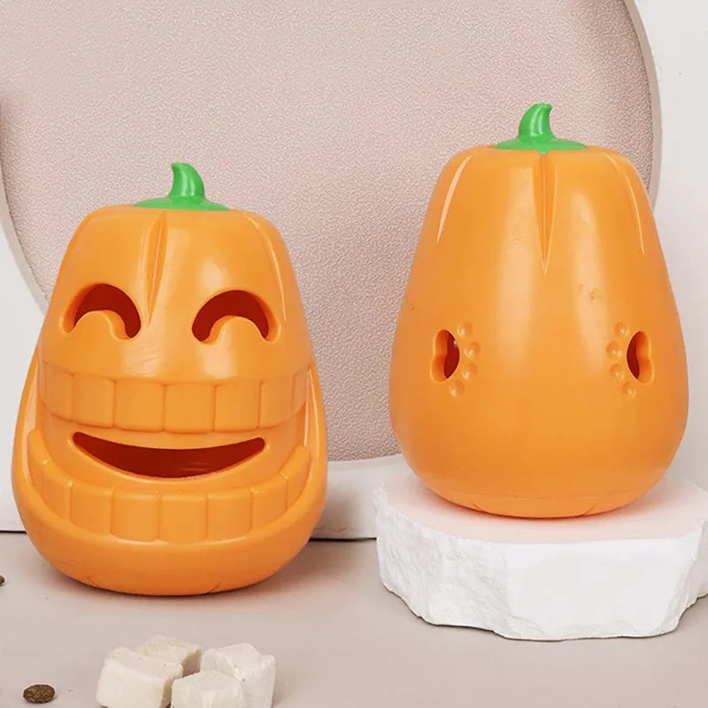 Halloween pumpkin shaped orange interactive dog chew toy with treat-dispensing funnel