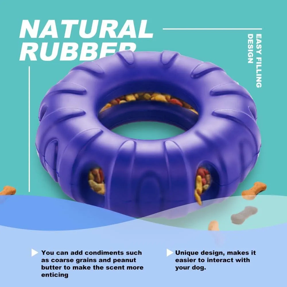 Blue rubber tyre-shaped dog chew toy with oval openings, shown next to dog treats.