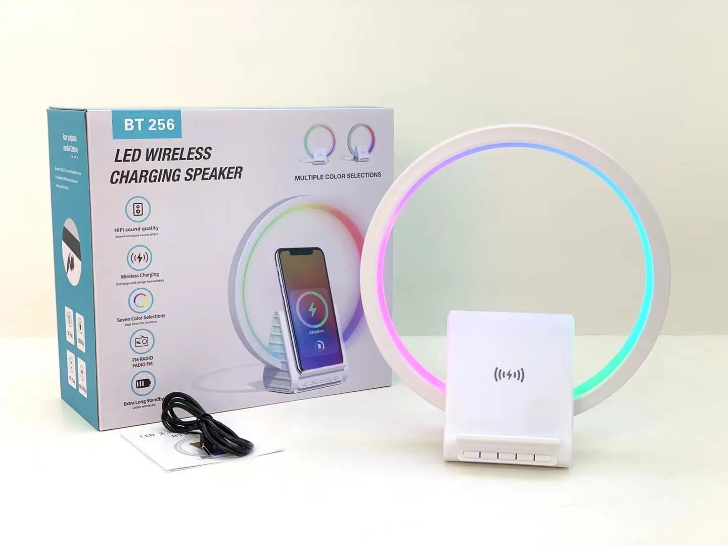 White circular smart Bluetooth speaker with wireless charging pad and ambient light, 225mm diameter