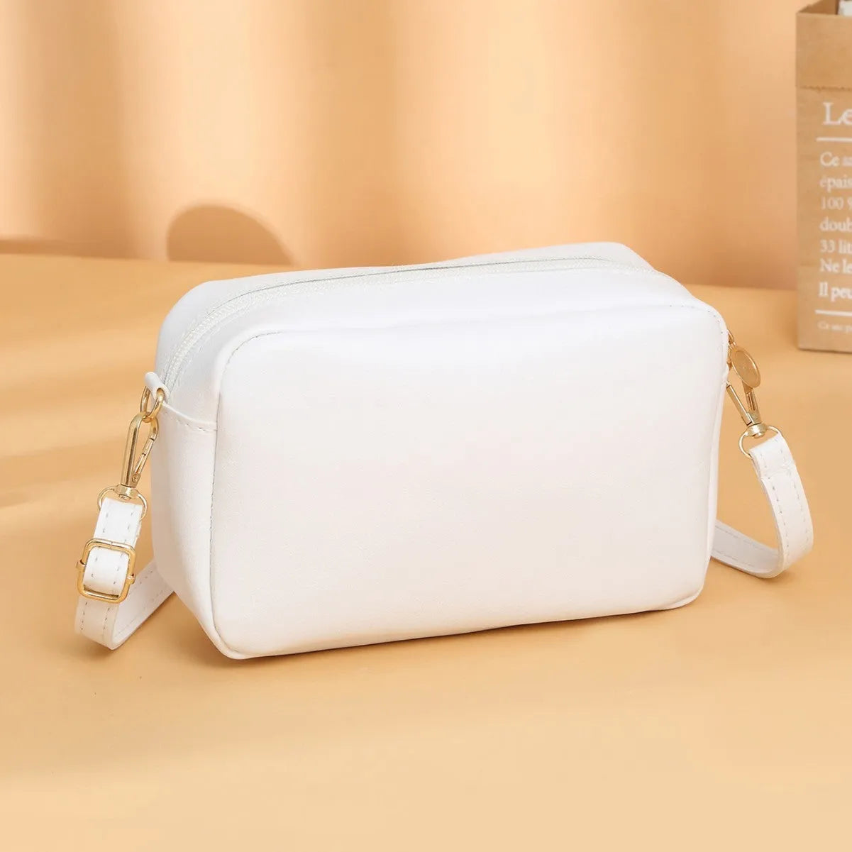 Solid colour PU ladies' shoulder bag with three-dimensional pockets in urban simplicity style