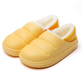 Green EVA waterproof garden slippers with non-slip sole and plush lining shown on wooden decking
