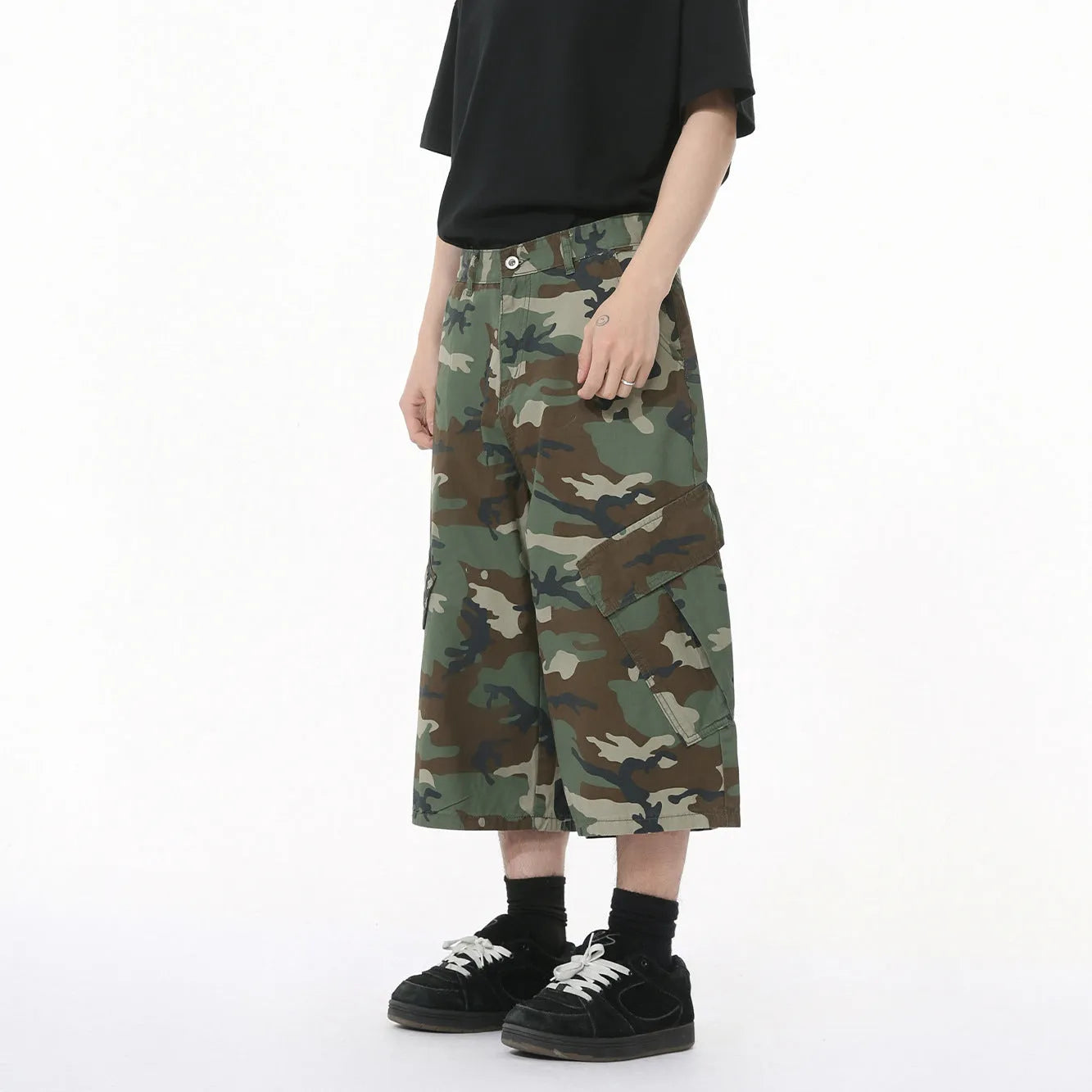 Men's cotton camouflage loose fit jeans with wide leg, cropped length, side stitching, and large pockets.