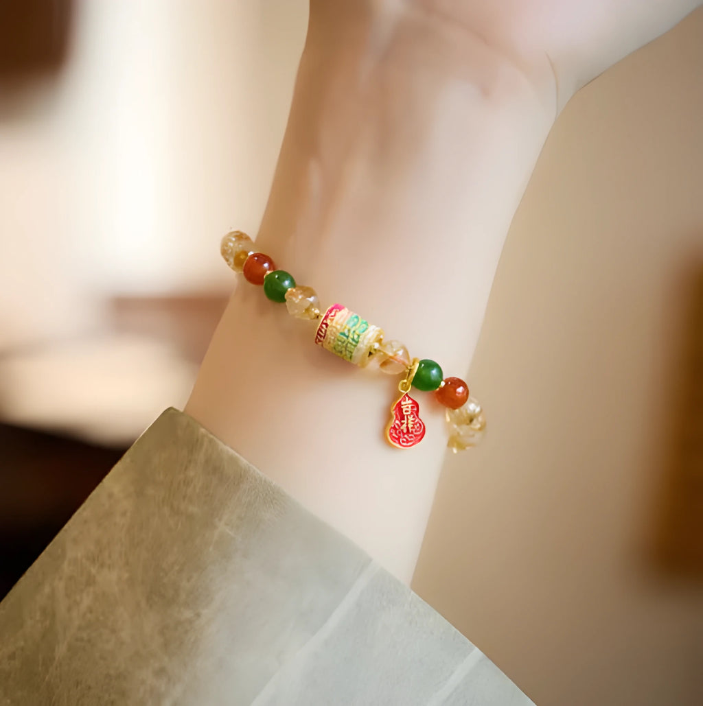 Hand-woven citrine five sutra bracelet with 6mm crystal beads on wrist