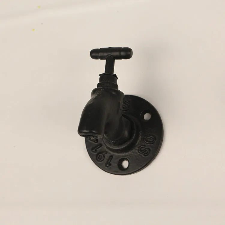 Water pipe style metal towel rack hook wall mounted in modern bathroom setting