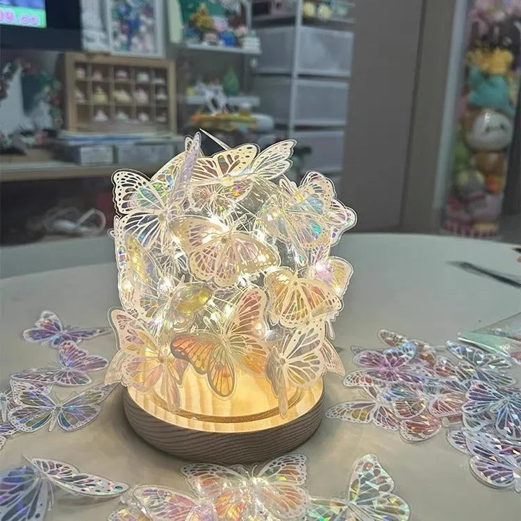 Butterfly night lamp with glass shade on raw wood base, measuring 12x15cm