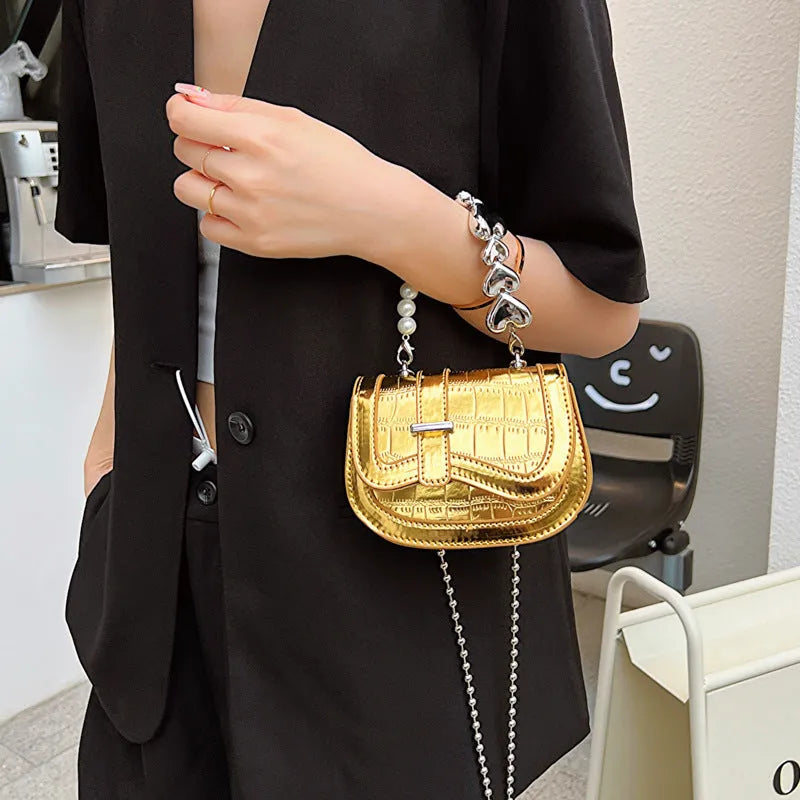 Silver PU leather mini tote saddle crossbody bag for women with a single strap.