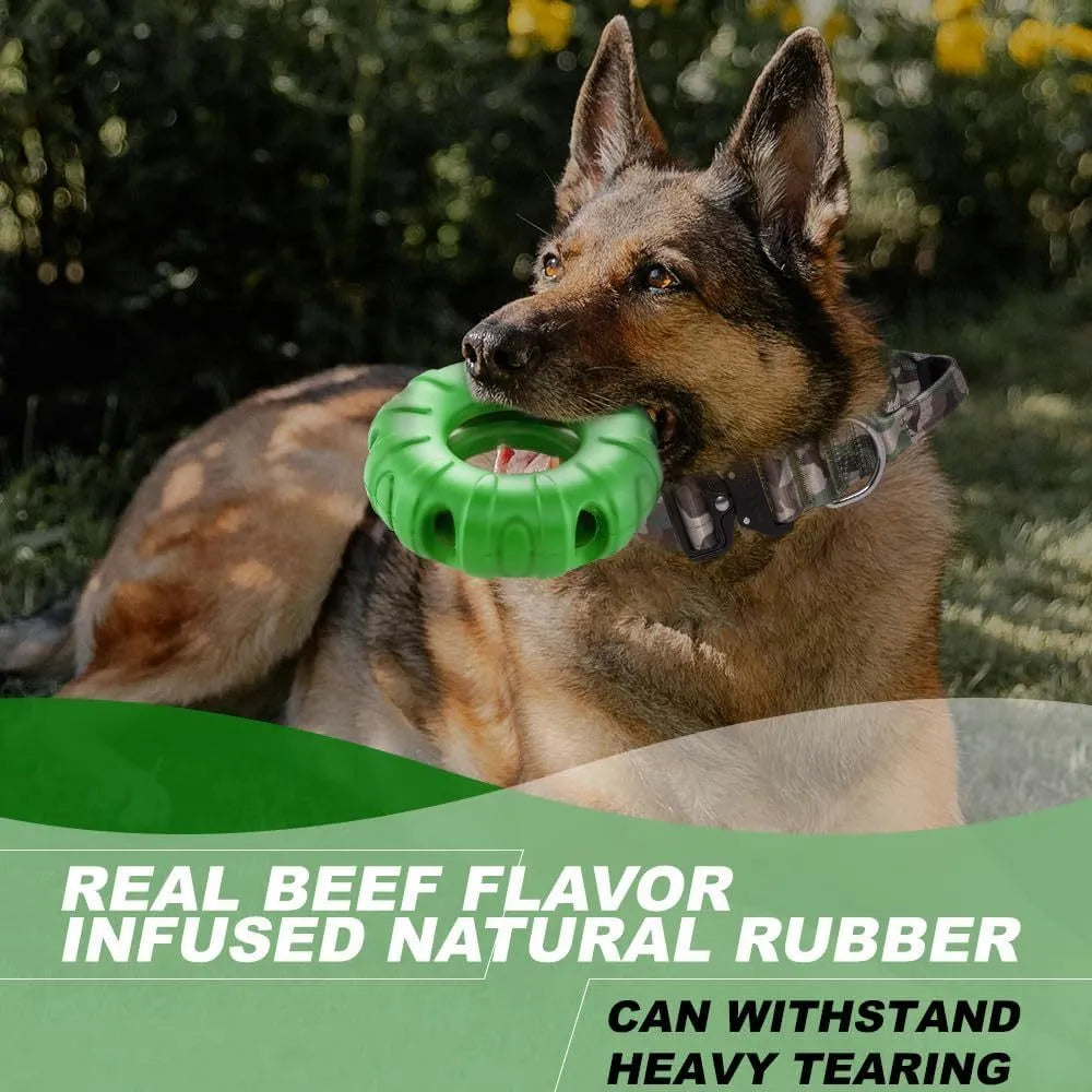 Blue rubber tyre-shaped dog chew toy with oval openings, shown next to dog treats.