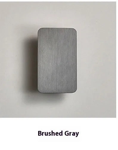 Minimalist Nordic style LED wall lamp in black finish mounted on wall showing adjustable light feature