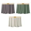Men's loose fit ice silk underwear in solid colours showing mid-waist design and breathable fabric texture.
