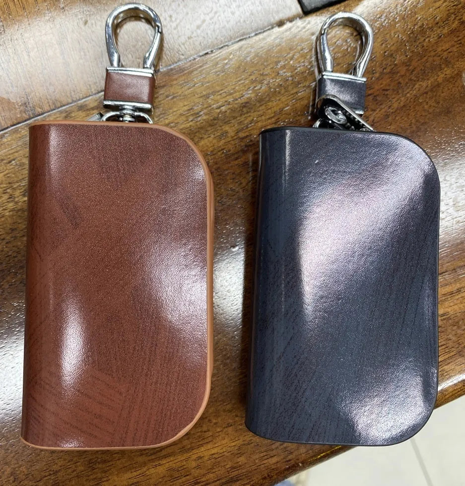 Genuine leather car key case with frosted finish showing black and brown colour options