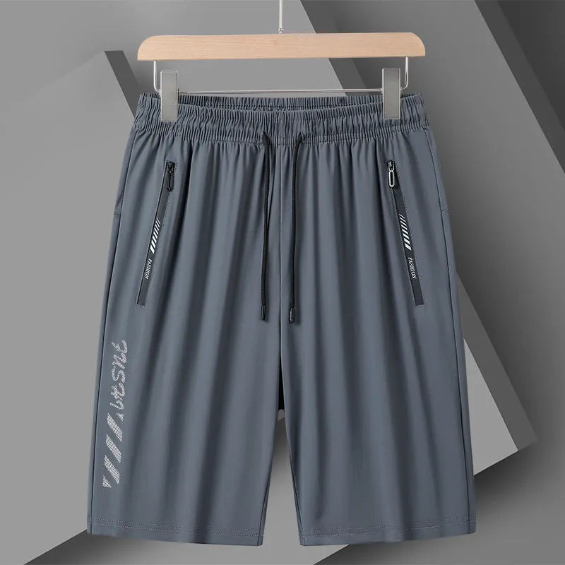 Men's black nylon quick-drying sports shorts with elastic waistband, shown in loose fit.