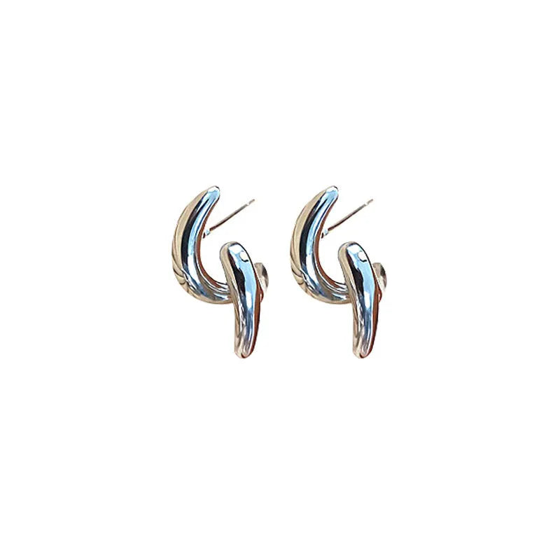 Pair of geometric copper stud earrings with textured line design and electroplated finish
