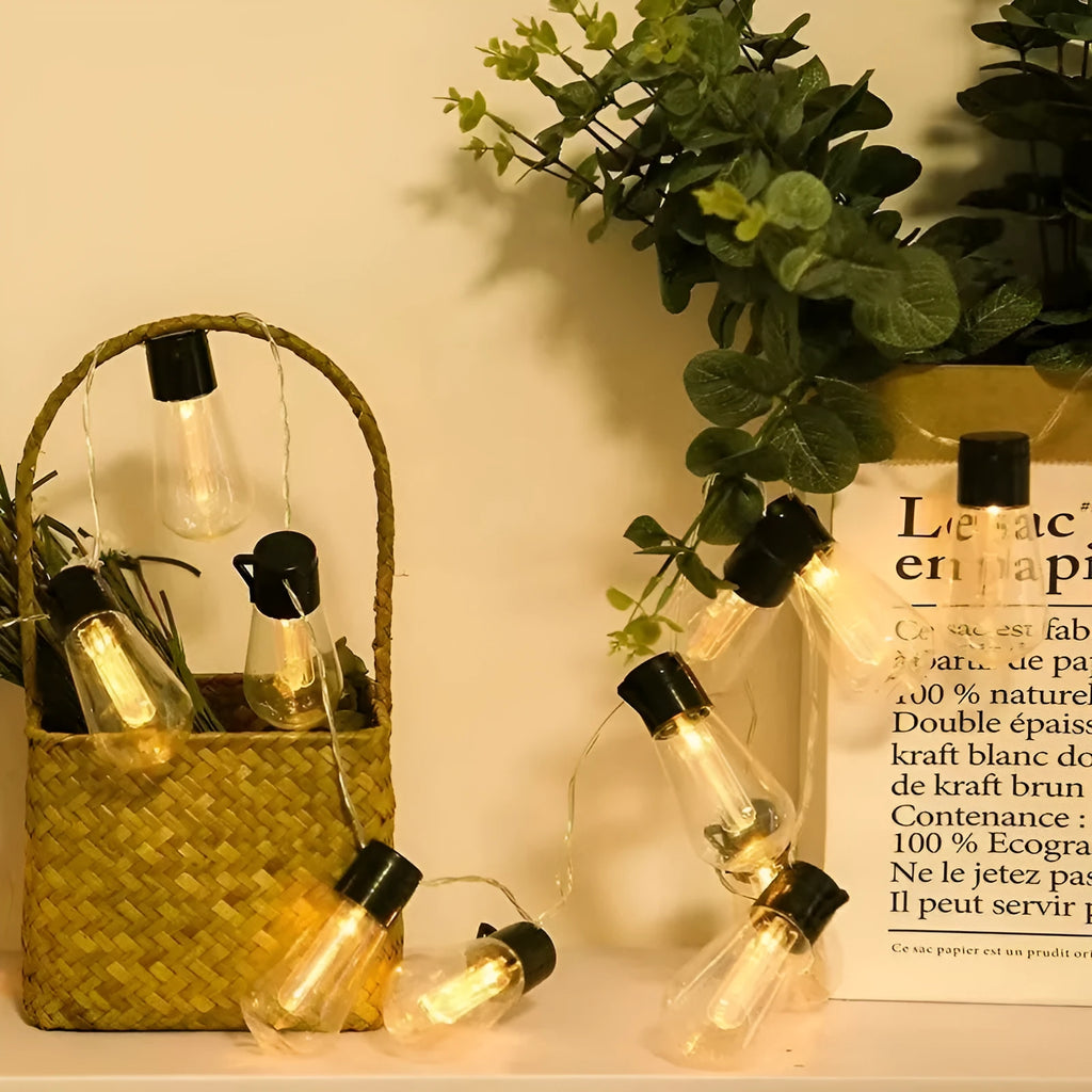 Retro infusion bottle shaped outdoor festoon lights with IP55 rating in earth instrument lighting chain arrangement