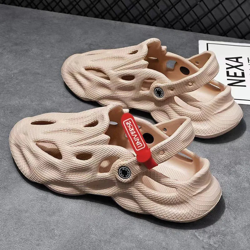 Pair of gray closed-toe EVA coconut slippers with a textured frosted finish and perforated upper.