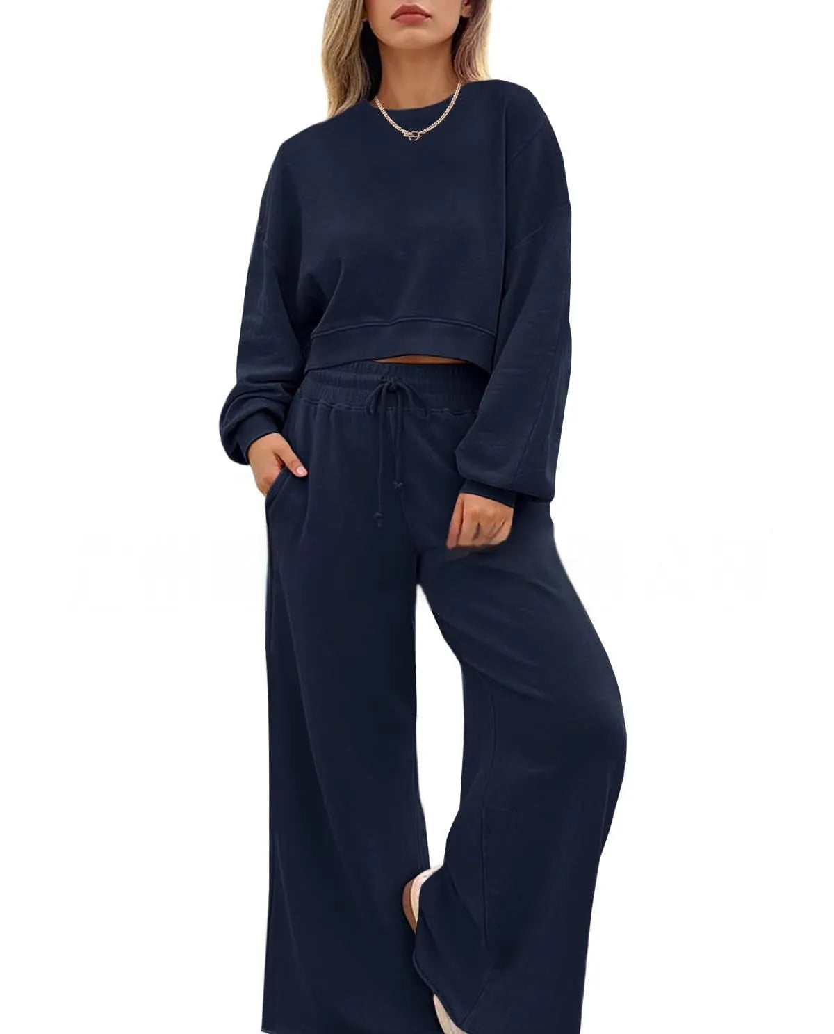 Women's solid colour polyester two-piece casual set with long sleeves and trousers.