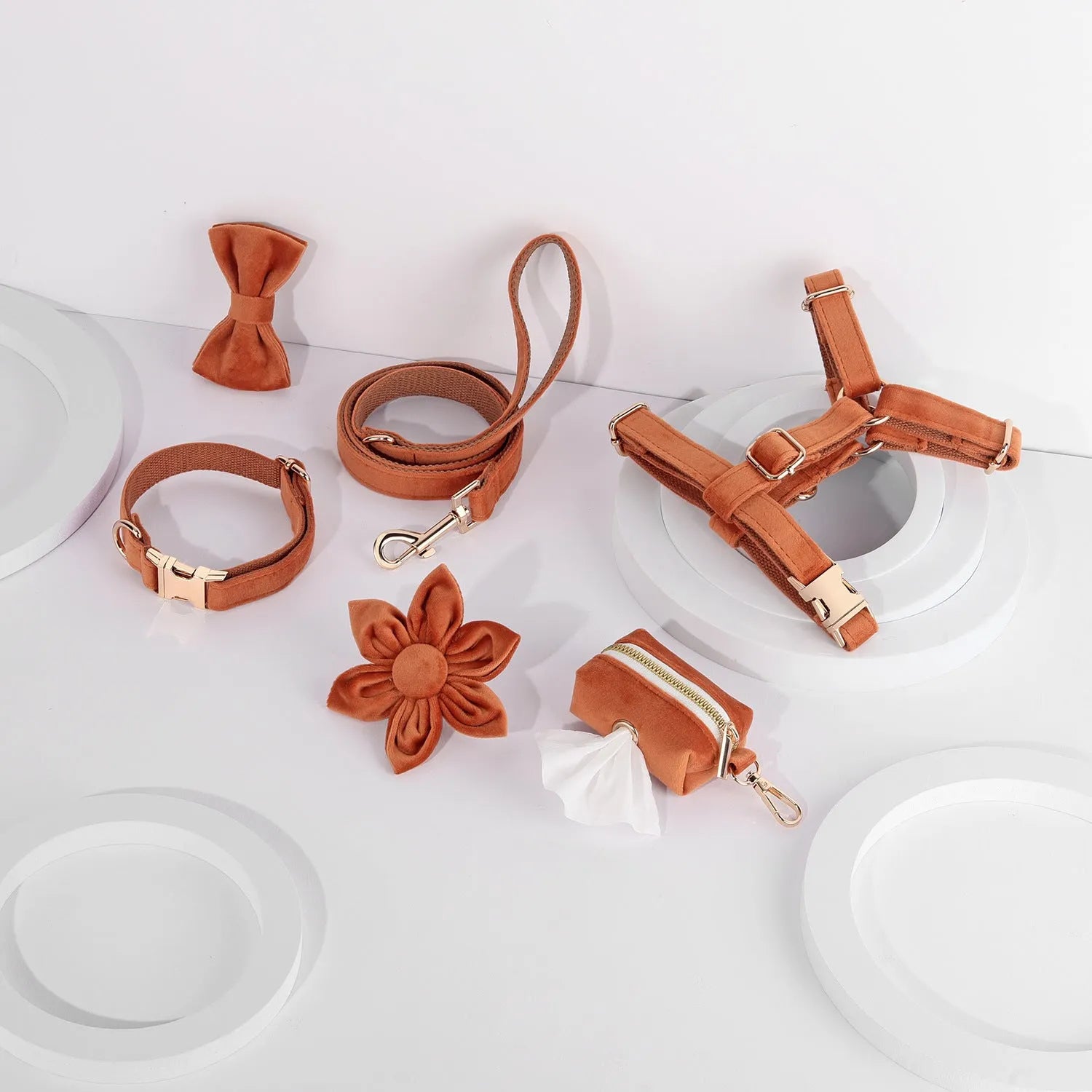 Soft cloth pet harness and lead set in velvet, showing collar, chest strap, lead, bow tie, and flower accessory.