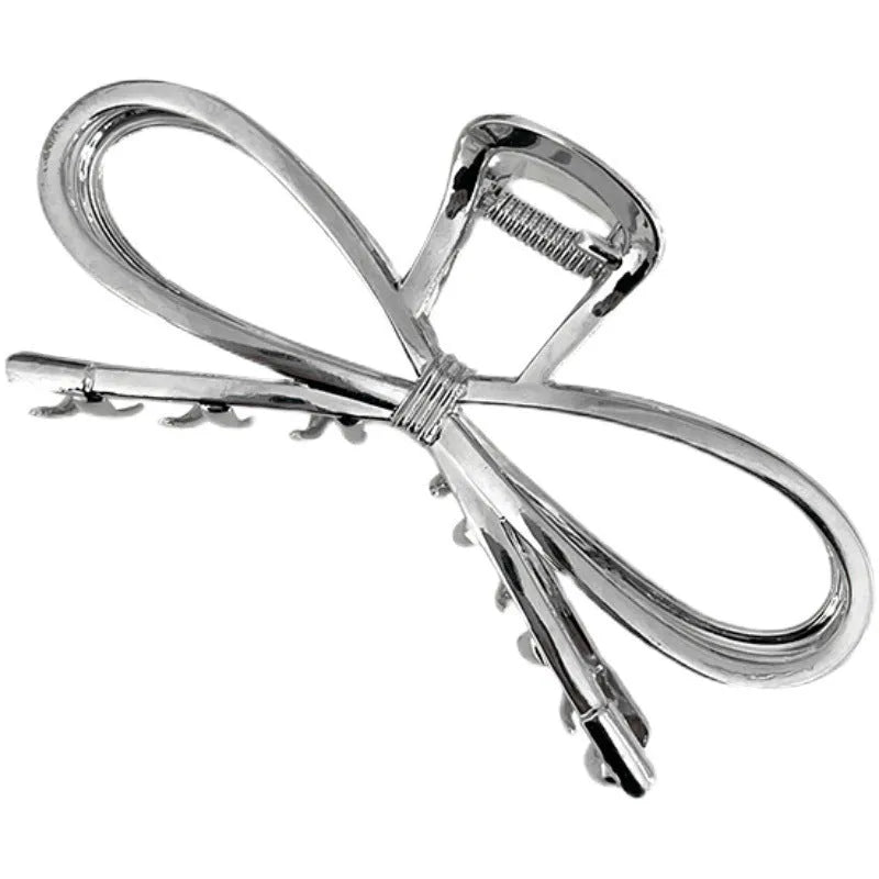 A silver women's hair barrette with a decorative Korean-style bow and an alloy clip.