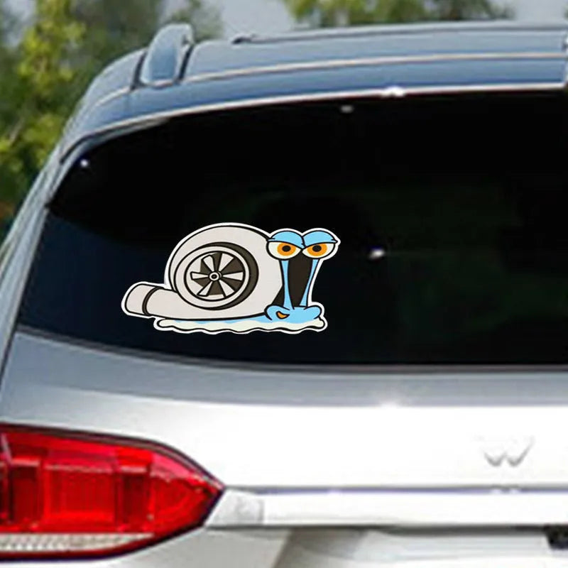 White reflective car sticker with a cartoon snail design, measuring 12 by 8 cm.