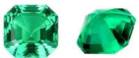Cultivated emerald gemstone in Columbian green colour showing various polished cuts on a white background.