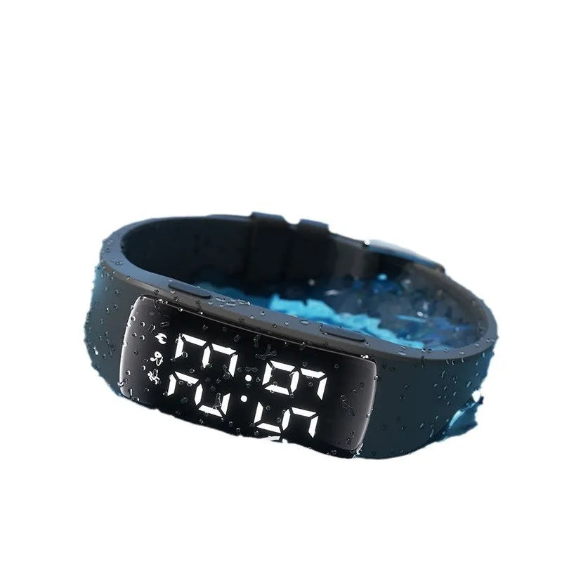 Black vibration alarm smart watch with LED display on a silicone strap, showing 50m waterproof rating.