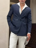 Men's striped double-breasted blazer on a hanger showing regular fit and length