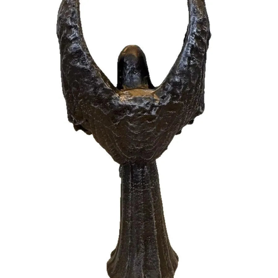 Dark angel resin statue ornament on a shelf, showing detailed sculptural form and dark colour finish.
