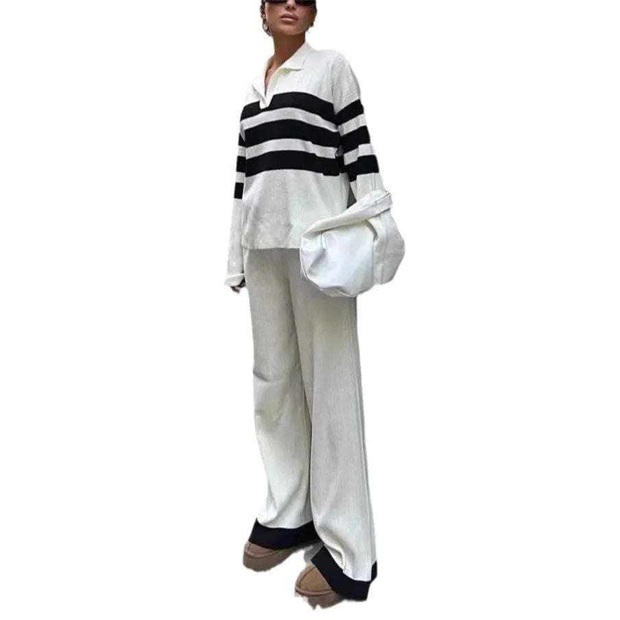Women's black and white striped knitted two-piece set with polo collar and matching trousers