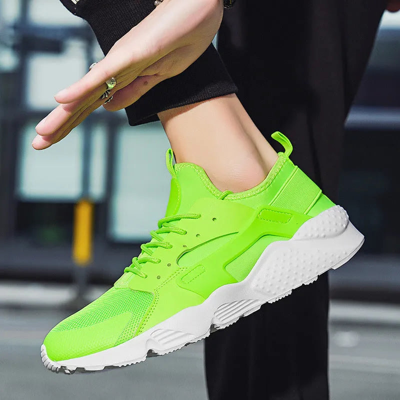 Men's low top casual shoes in fluorescent red with mesh upper, cross shoulder straps, and flat MD sole.