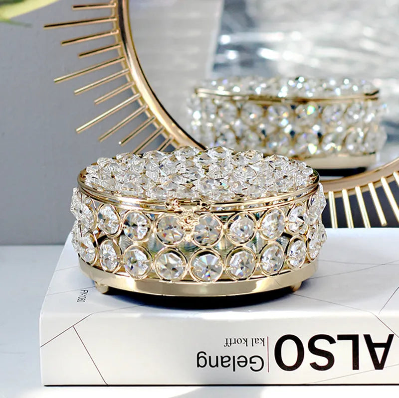 Crystal glass jewellery box with transparent sides and a French gold metal frame.