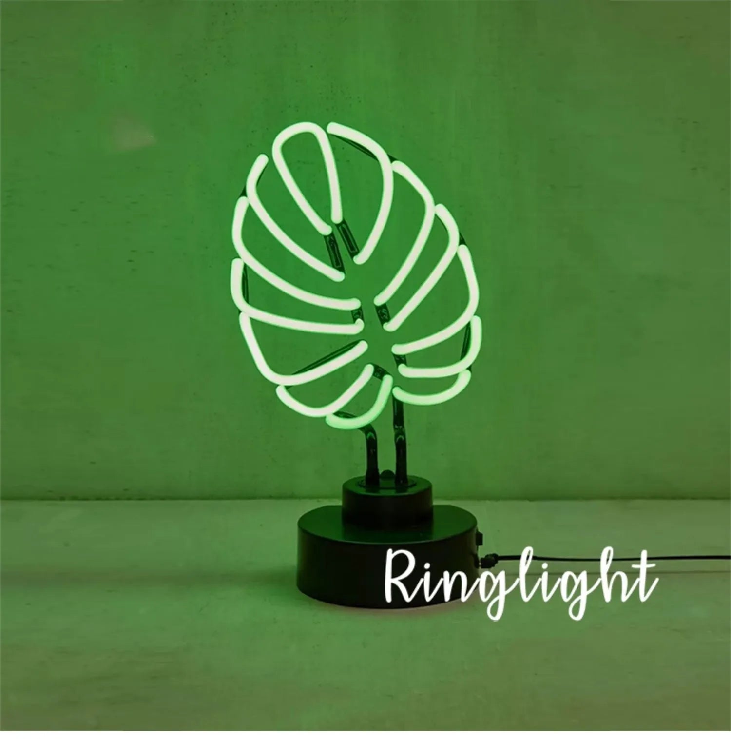 Minimalist bamboo-shaped white desk lamp with green illumination on wooden desktop