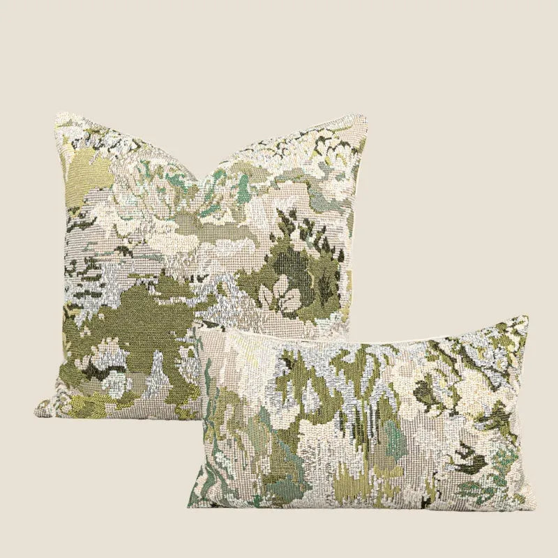 Green abstract floral wool blend decorative cushion on a neutral background.