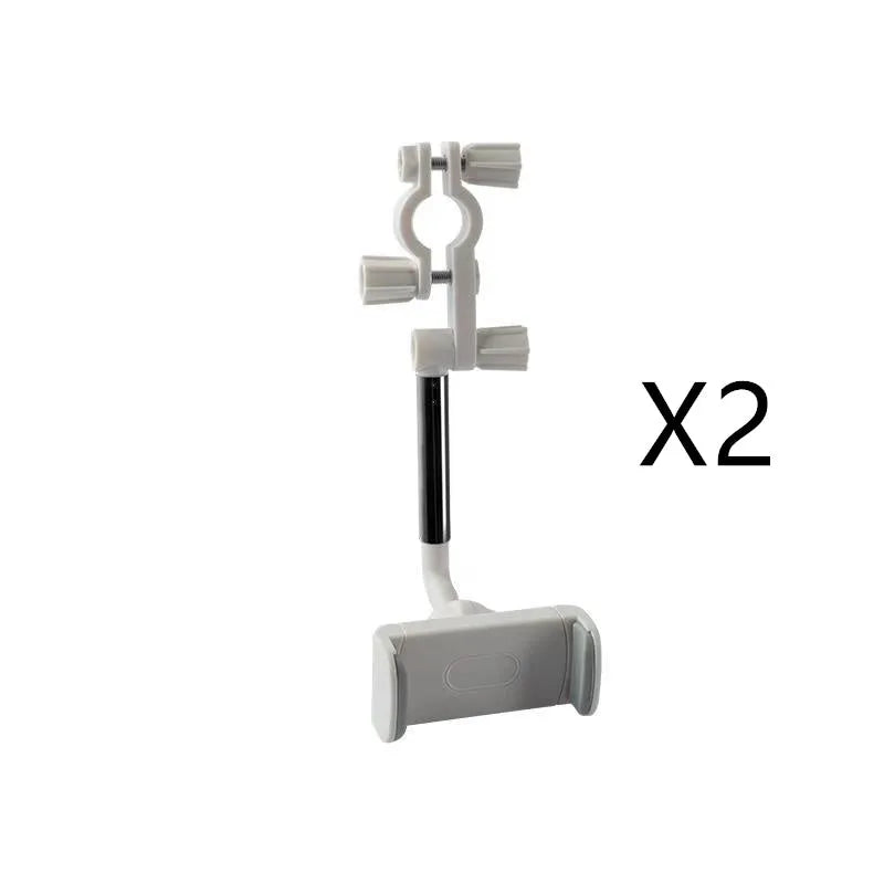 Black ABS plastic mobile phone bracket mounted on vehicle rearview mirror holding smartphone