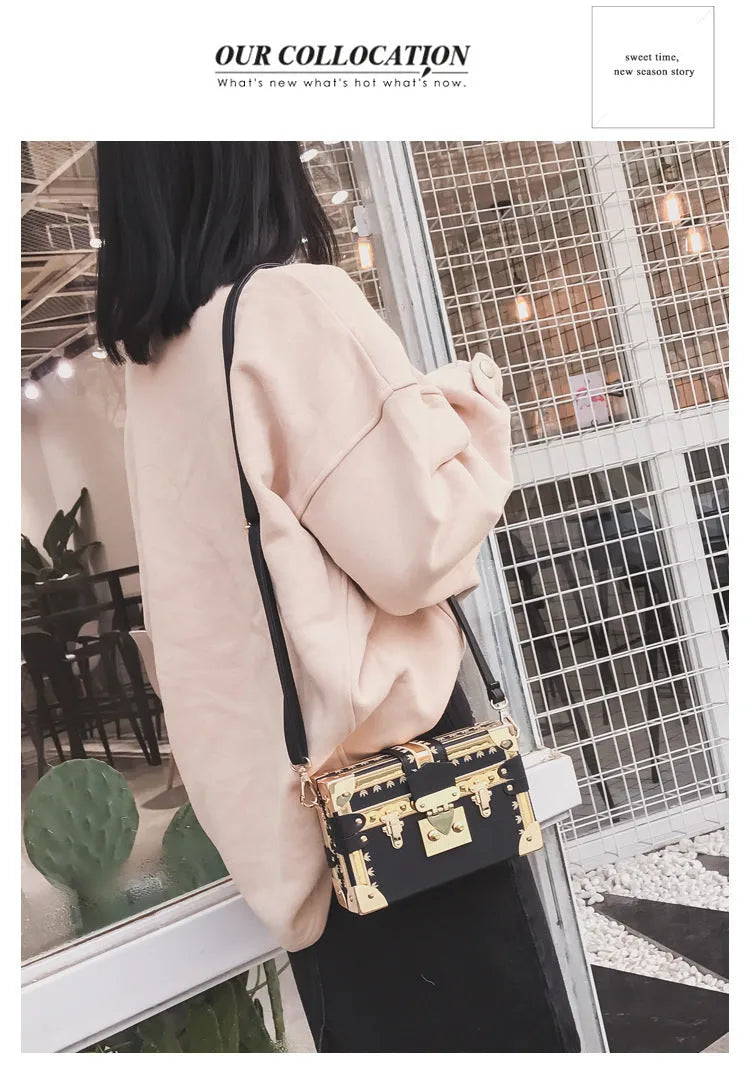 Women's structured shoulder bag with flap closure and adjustable crossbody strap in black or green