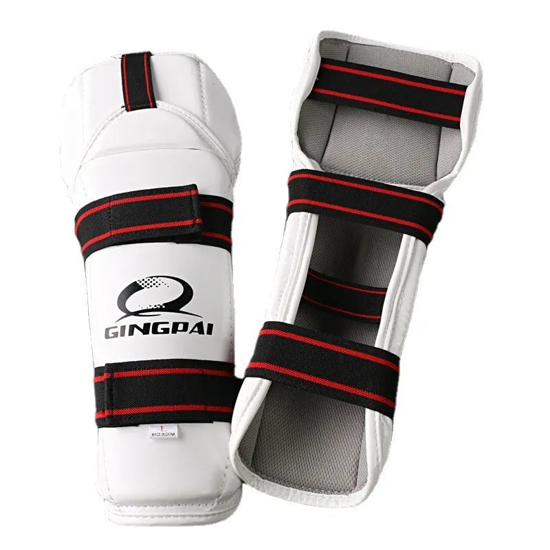 Taekwondo arm and leg protective gear set showing arm guards and leg protectors in standard sizing