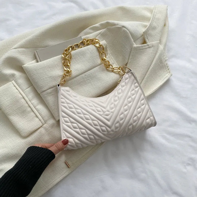 Brown pleated chain shoulder bag showing vertical square shape and adjustable strap