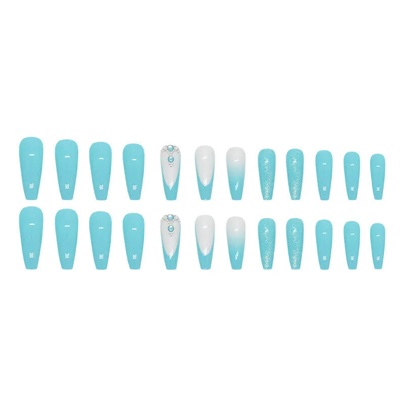 Long solid colour ballet artificial nails with blue diamond glitter glue on a pink background