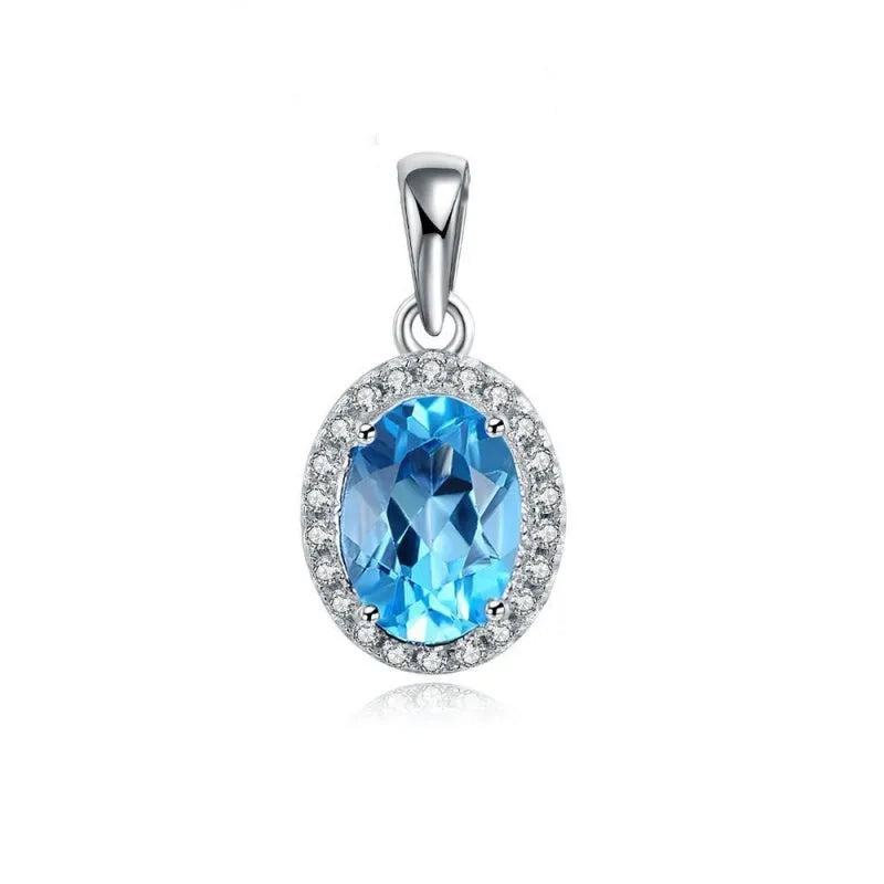 Four-piece 925 sterling silver jewellery set with blue topaz stones: geometric necklace, earrings, ring, and pendant.