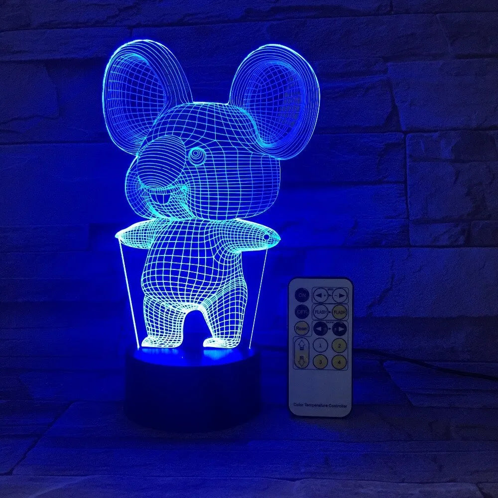 Black koala-shaped LED night light on a table showing multi-colour glow option.