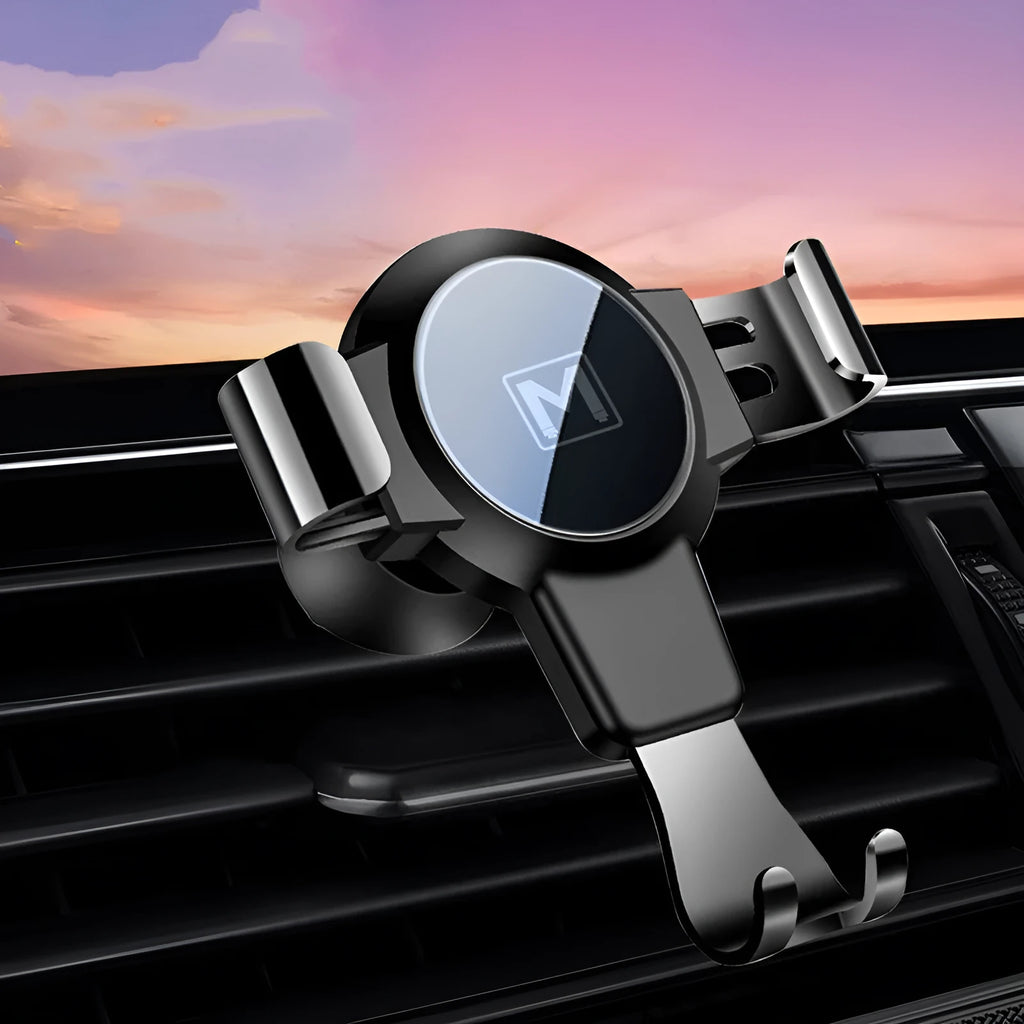 Black ABS gravity mirror car phone holder attached to a vehicle air vent.