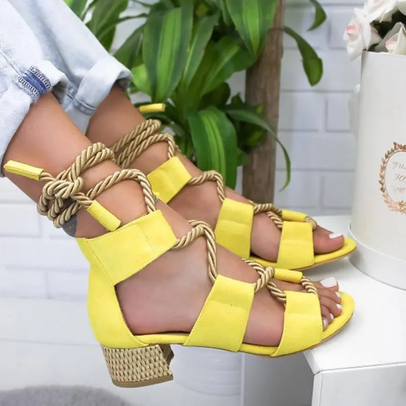 Women's beige suede sandals with a chunky heel, colour-block panels, and an ankle strap.