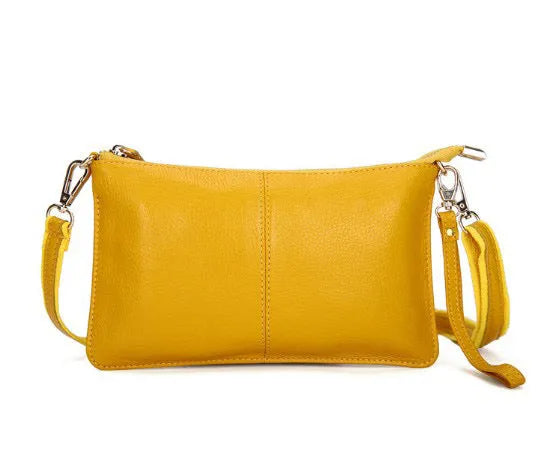 Structured cowhide leather lady slant bag showing front zipper compartment and dual strap options