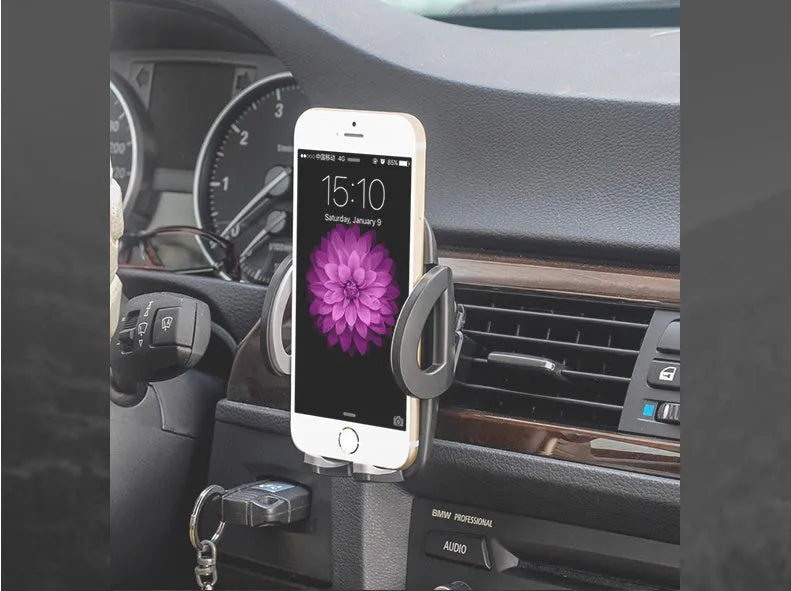 Black plastic car mobile phone holder mounted on vehicle air conditioning outlet