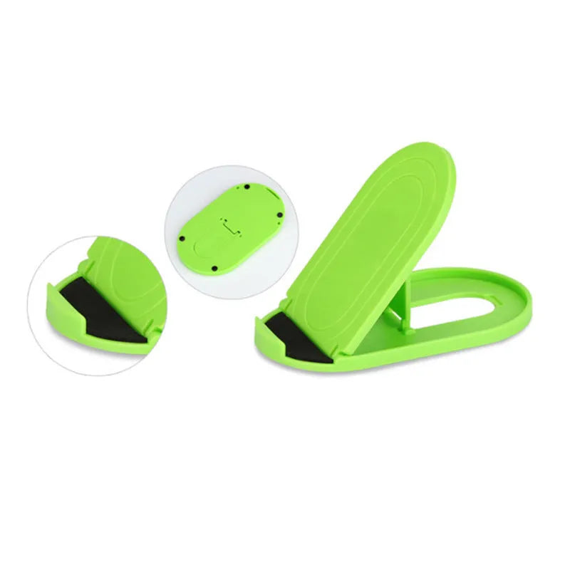 Plastic mobile phone stand with adjustable lazy bracket in six colour options on tabletop