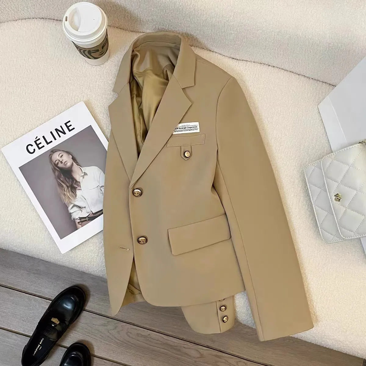 Black women's loose-fit short coat jacket with pockets and regular long sleeves.