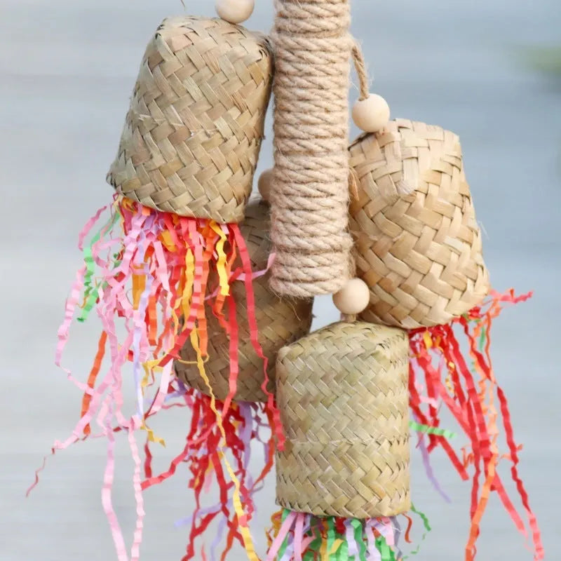 Wood and sisal parrot toy with colourful shredded paper filling, size 15 by 35 centimetres