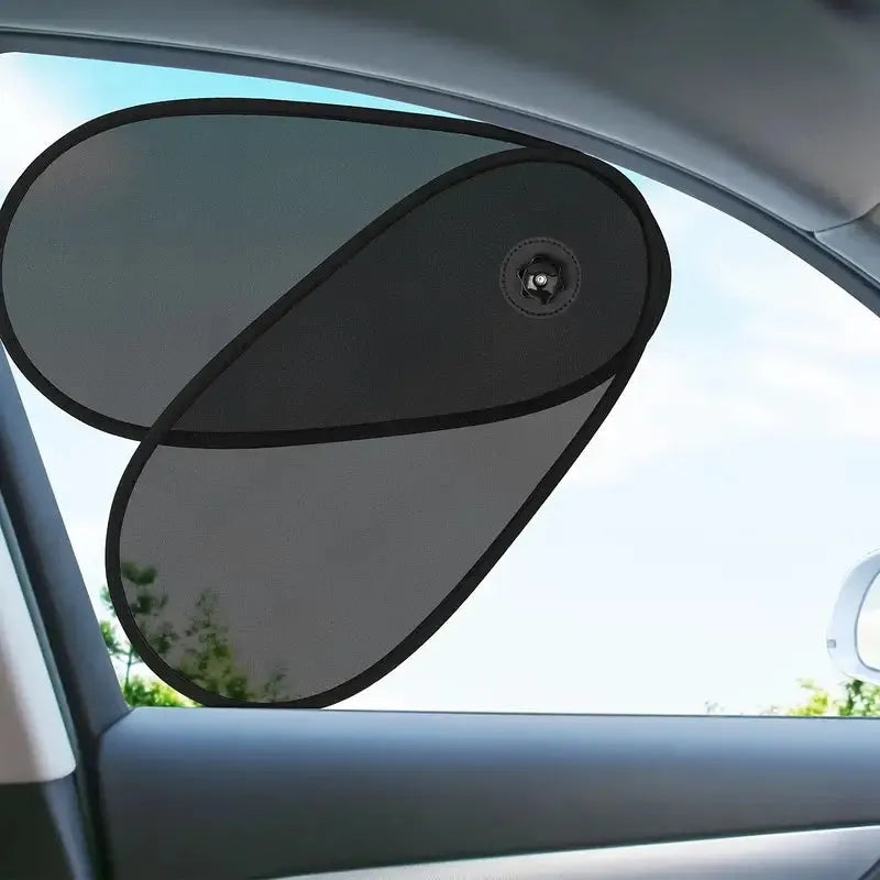 Black stretchy car side window sunshade for babies, shown with suction cups attached.
