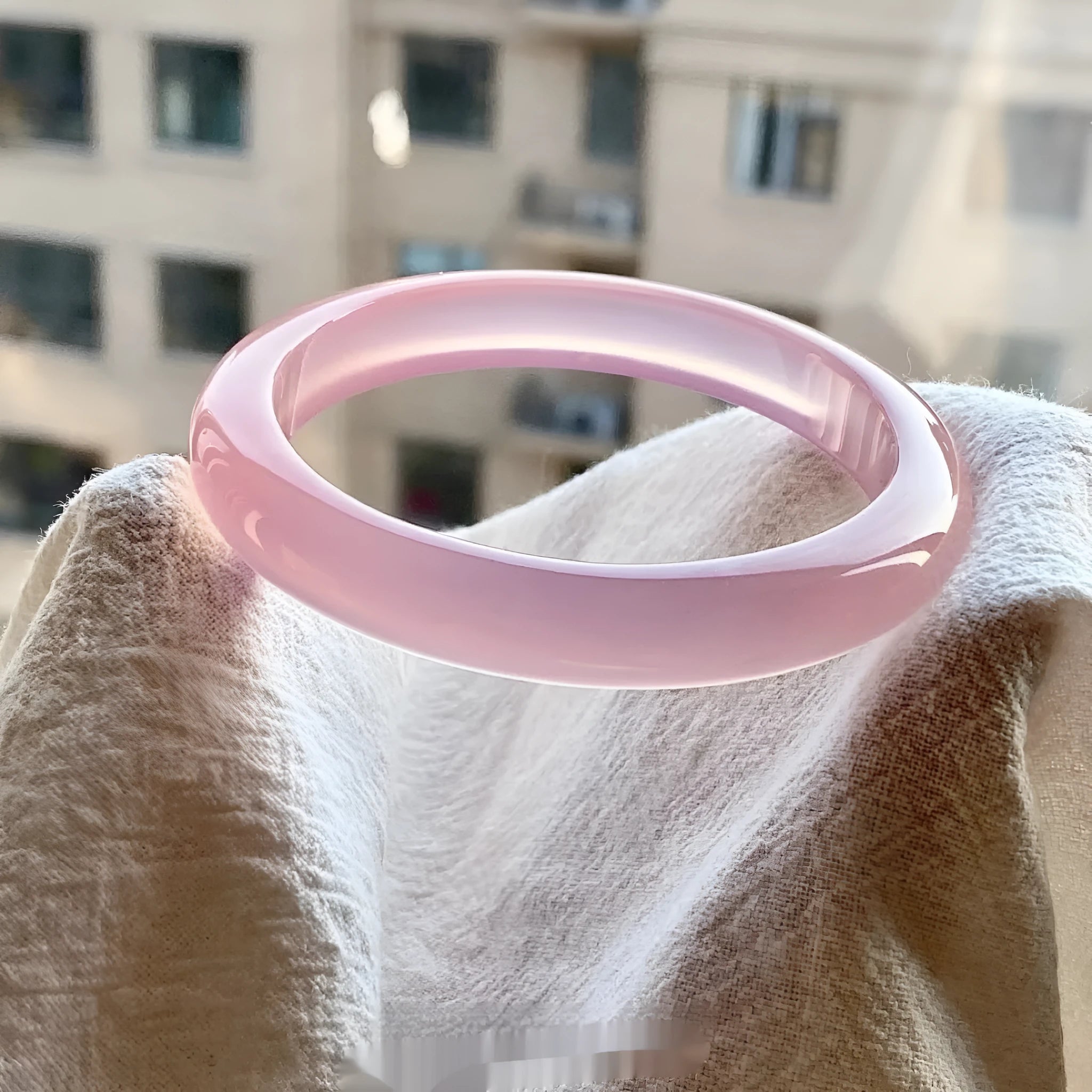 Natural agate wide tyre bracelet in 10mm width showing pink stone variant with size marking