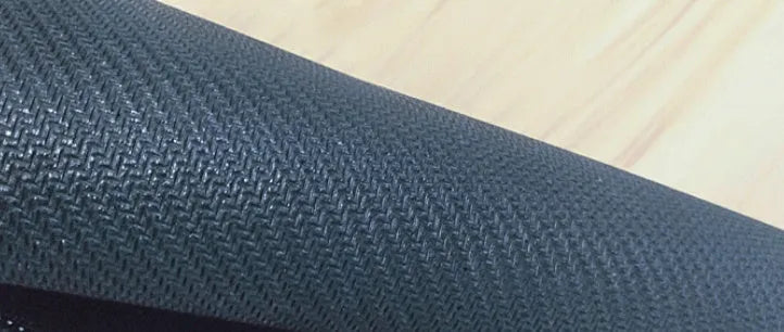 Large thermal transfer printed mouse pad with natural rubber non-slip base on a desk.
